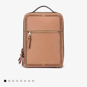 Lightly used cream/tan CALPAK backpack